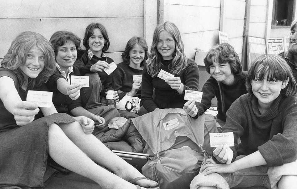 Female tennis fans show off their tickets as they queue for the 1976 Wimbledon Tennis Championships