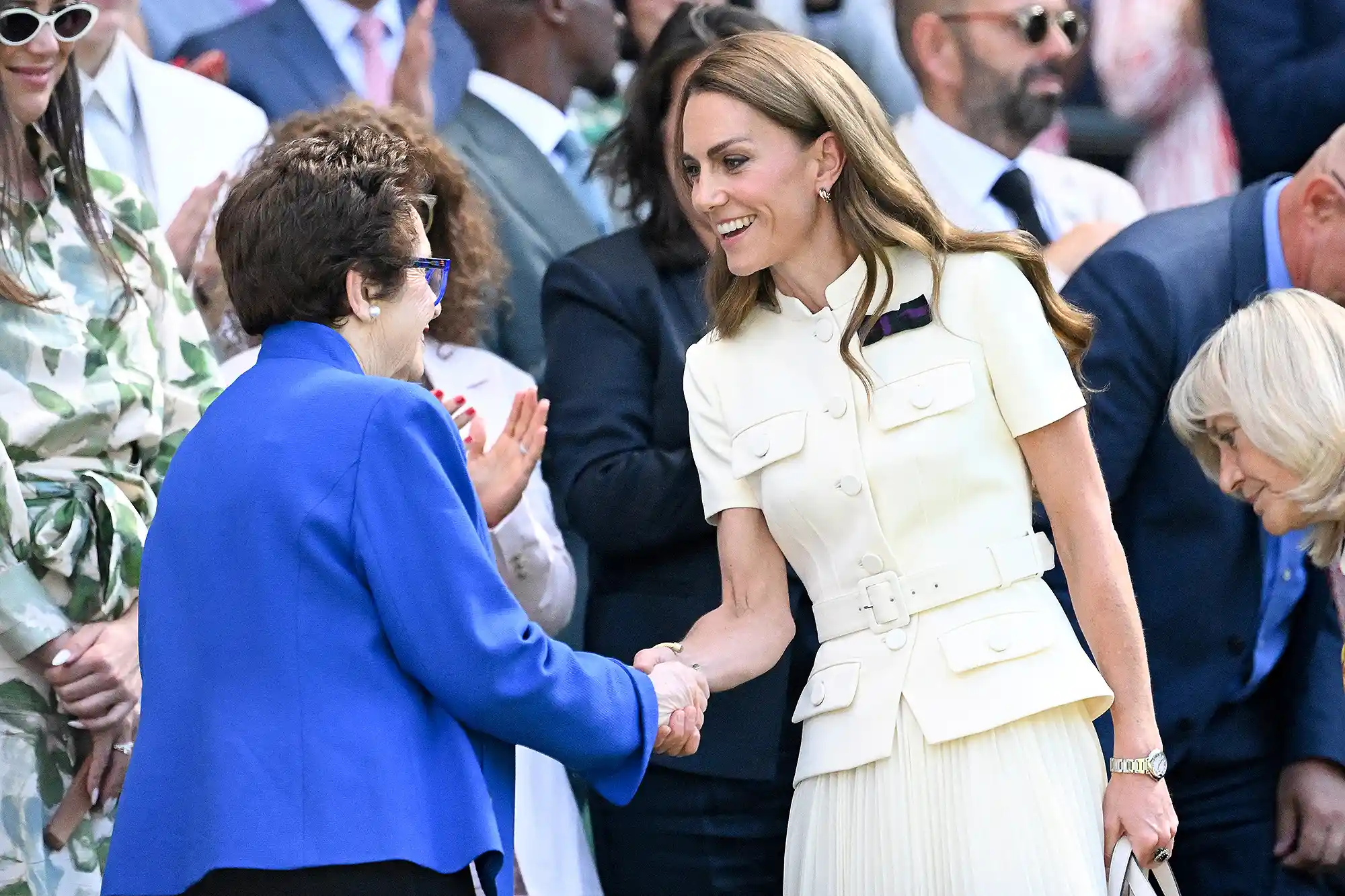 Britain's Catherine, Princess of Wales (R) shakes hands with US tennis player Billie Jean King upon arrival in the Royal Box on Centre Court for the women's singles final tennis match between Poland's Iga Swiatek and US player Amanda Anisimova on the thirteenth day of the 2025 Wimbledon Championships at The All England Lawn Tennis and Croquet Club in Wimbledon, southwest London, on July 12, 2025.
