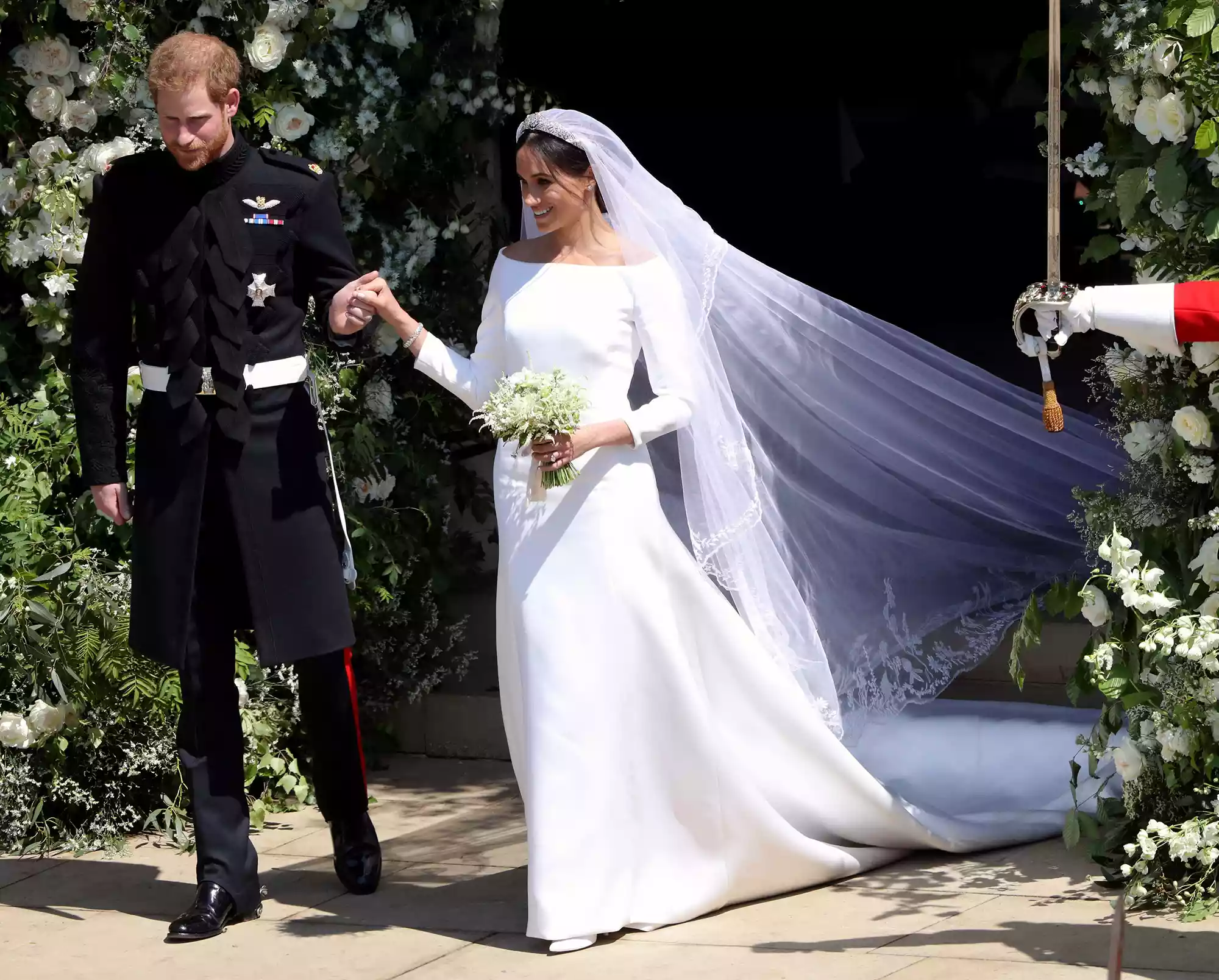Prince Harry, Duke of Sussex and Meghan, Duchess of Sussex leave St George's Chapel, Windsor Castle after their wedding ceremony on May 19, 2018 in Windsor, England