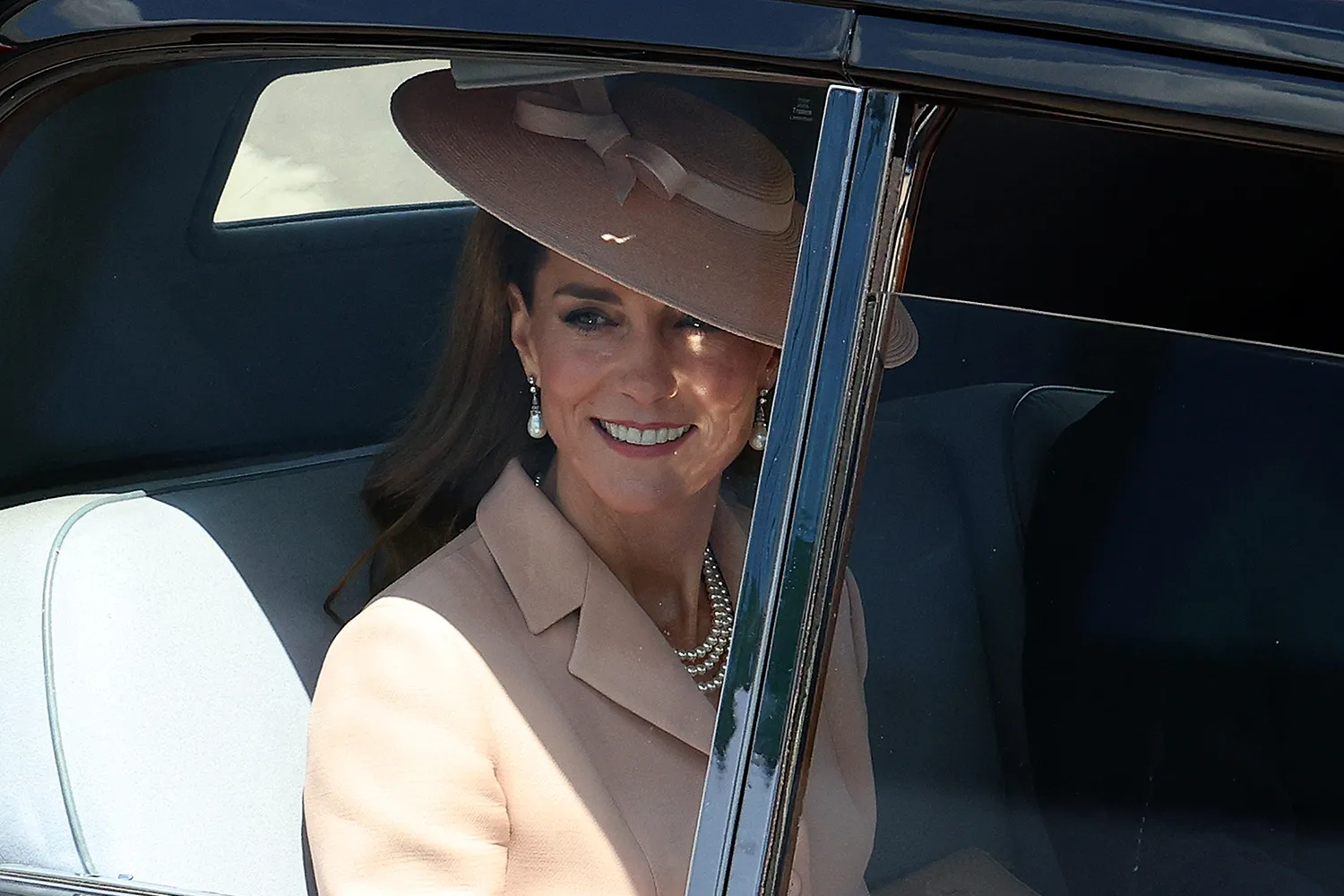 Britain's Prince William, Prince of Wales and Britain's Catherine, Princess of Wales leave by car after greeting France's President Emmanuel Macron and his wife Brigitte Macron upon their arrival at RAF Northolt, west of London
