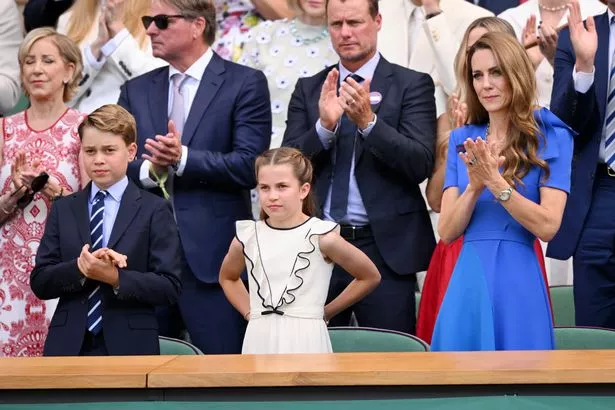George alongside mum Kate and younger sister Princess Charlotte 