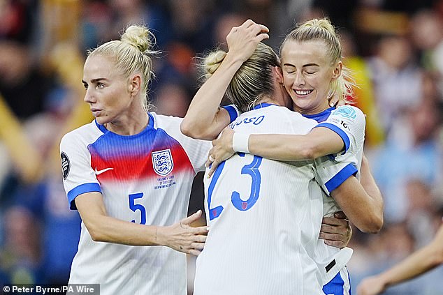Alessia Russo (centre) celebrates scoring England's first goal of the game with Chloe Kelly