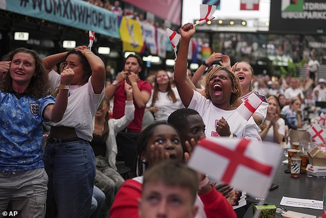 England supporters celebrate during the penalty shootout