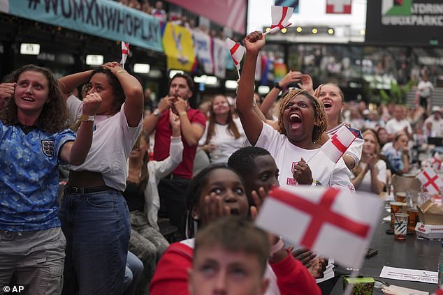England supporters celebrate during a live screening of the final in the Croydon area of London