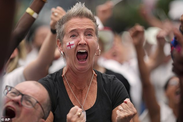 England supporters celebrate during a live screening of the Women's Euro 2025 final soccer match between England and Spain at the Boxpark in Croydon