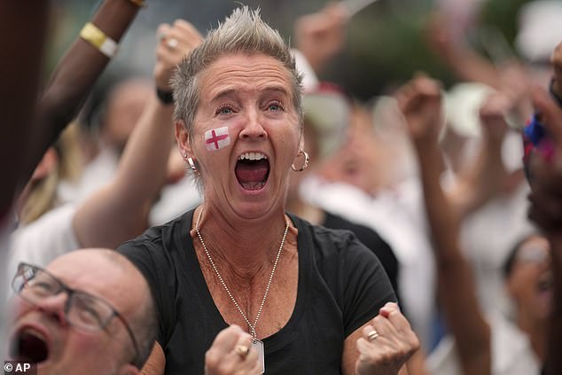 England supporters celebrate during a live screening of the final in the Croydon area of London
