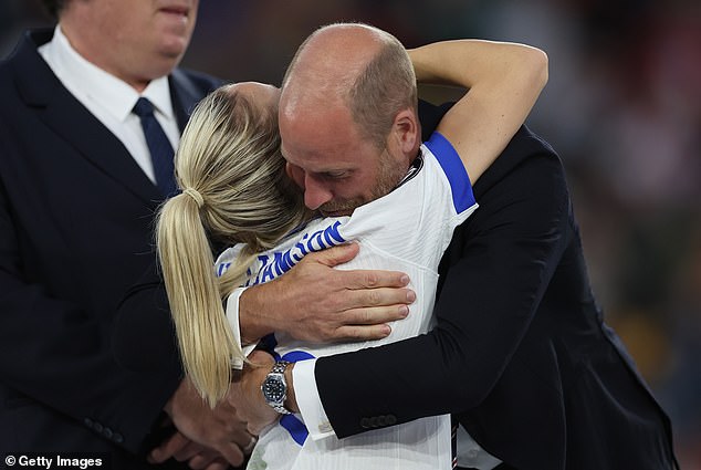 William, Prince of Wales celebrates with Leah Williamson
