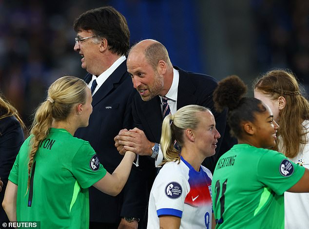 Hannah Hampton shakes hands with Prince William after England won the final