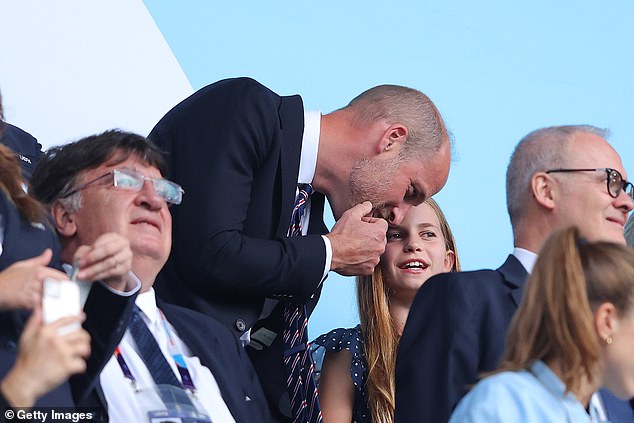 Charlotte looks to be highly invested in the gameplay, at one point whispering a spot of her own analysis to her smiling father (pictured)