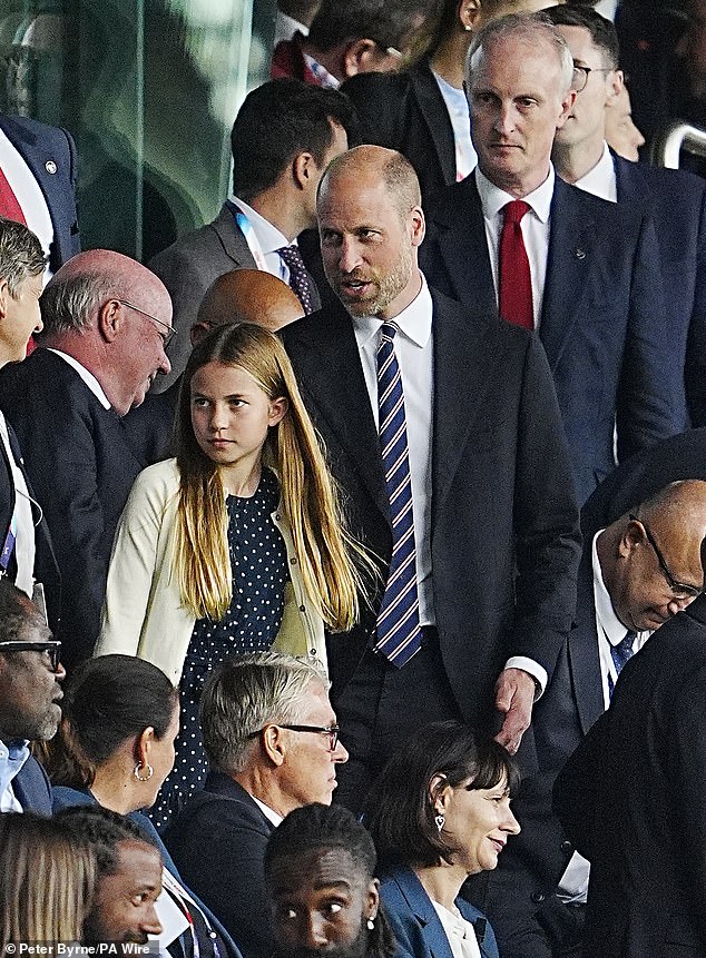 Charlotte was accompanied by her doting father William as they made their way through the stands