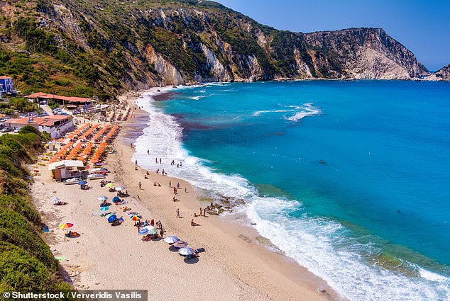 Petani Beach in Kefalonia features turquoise waters, golden sand, and is surrounded by cliffs (file image)