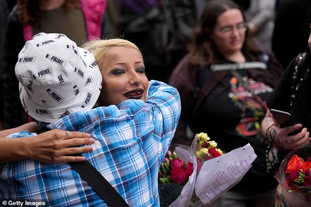 Fans have been sharing embraces as they mourn Ozzy Osbourne in Birmingham