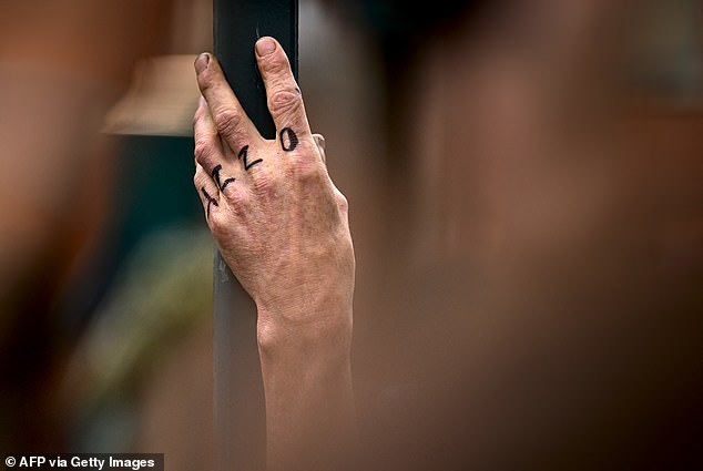 This admirer had Ozzy Osbourne's first name painted on their hand held up in his honour