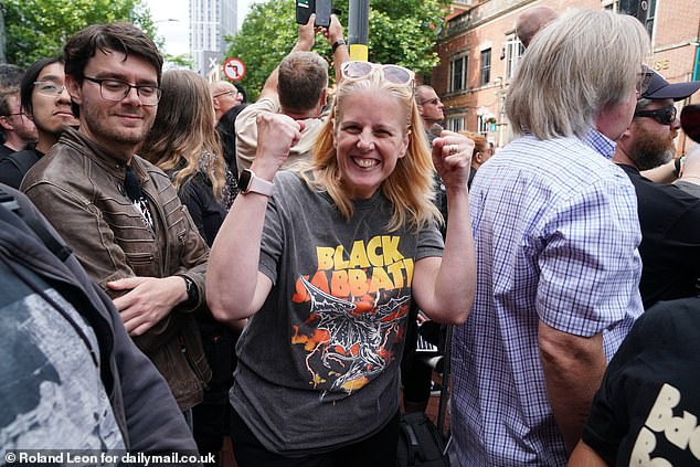 Dawn Woolven (pictured) was wearing a Black Sabbath as she joined the throng of mourners