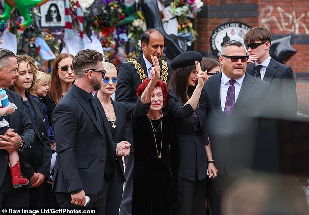 Sharon Osbourne gave a peace sign towards Ozzy Osbourne fans turning out in Birmingham