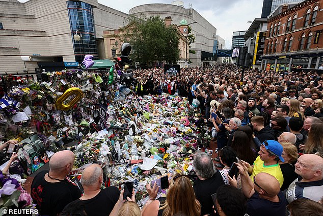 Thousands gather around tributes at the Black Sabbath Bridge, named in honour of the heavy metal band