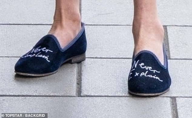 She wore shoes bearing the Royal Family's unofficial motto: 'Never complain, never explain'