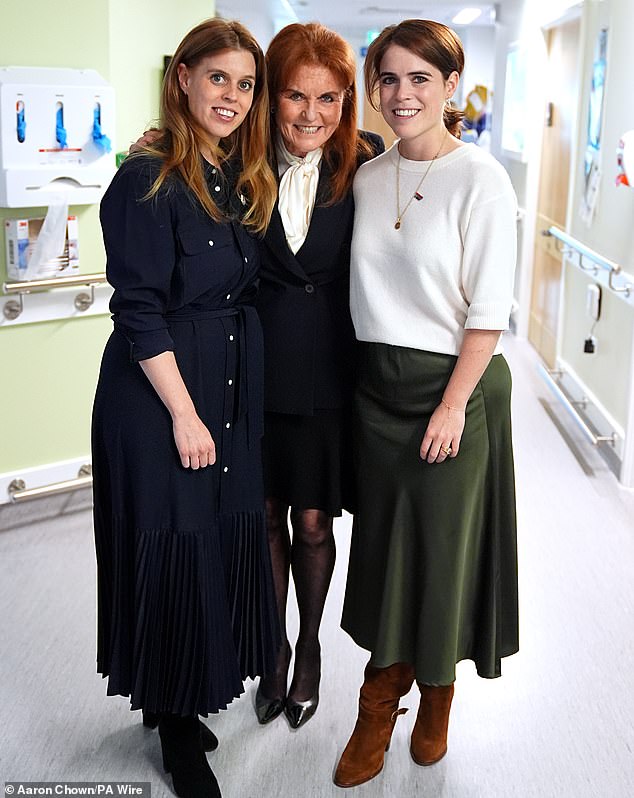 Pictured: Sarah, Duchess of York posed for a photo with her daughters Beatrice and Eugenie during a visit to the Teenage Cancer Trust unit at University College Hospital, London