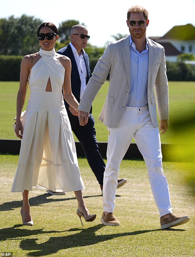 Prince Harry, right, and wife Meghan Markle, Duchess of Sussex. A senior aide to the late Queen Elizabeth II says Harry must shed the idea he is a victim