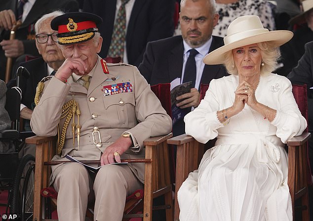 The pair appeared deeply moved after a veteran went 'off-script' to salute the monarch during the VJ Day service today