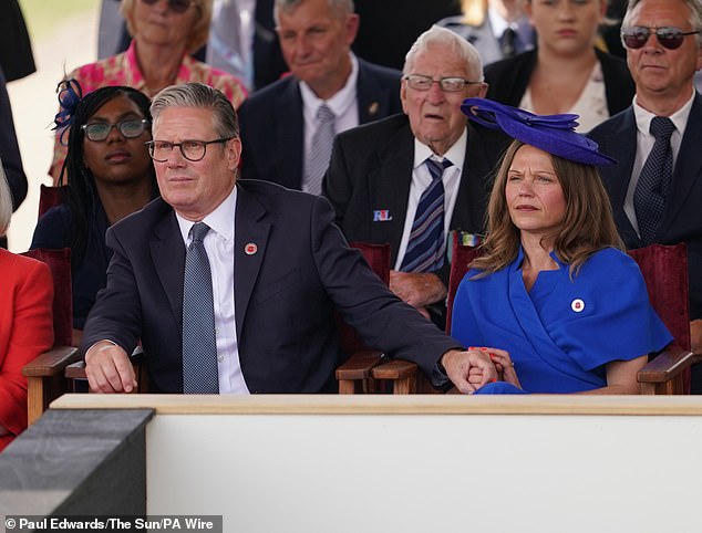 Sir Keir Starmer holds the hand of wife Lady Victoria Starmer during the national Service of Remembrance