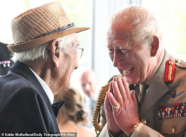King Charles III with with Yavar Abbas during a reception for VJ veterans and their families hosted by the Royal British Legion at The Aspects Building following a national Service of Remembrance to mark the 80th Anniversary of VJ Day