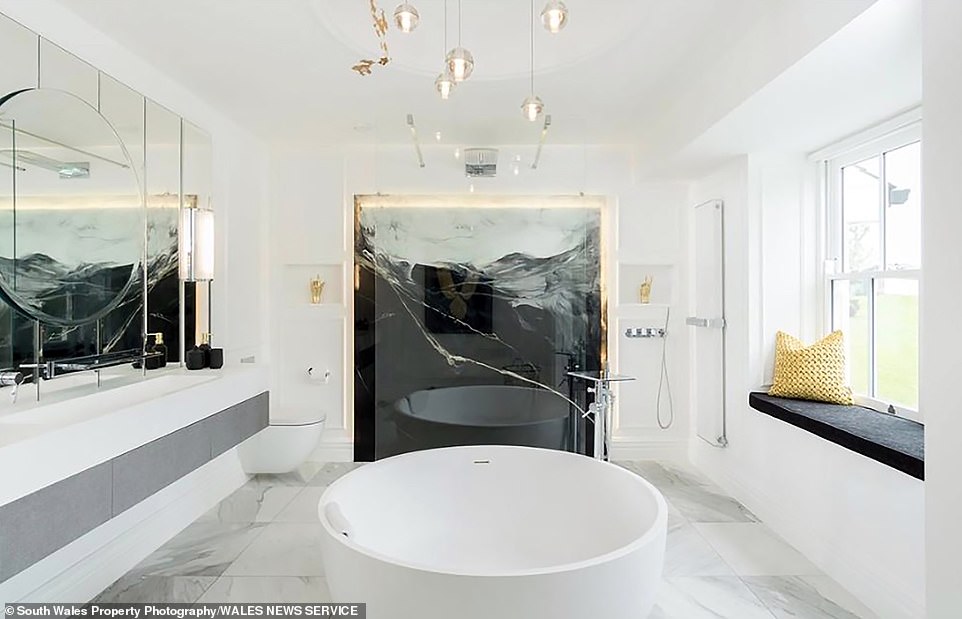 Pictured: Just one of the bathrooms at Llwynddu House in Cowbridge, Vale of Glamorgan, as the current owners look to sell Tom Jones' former Welsh property for £2.6 million