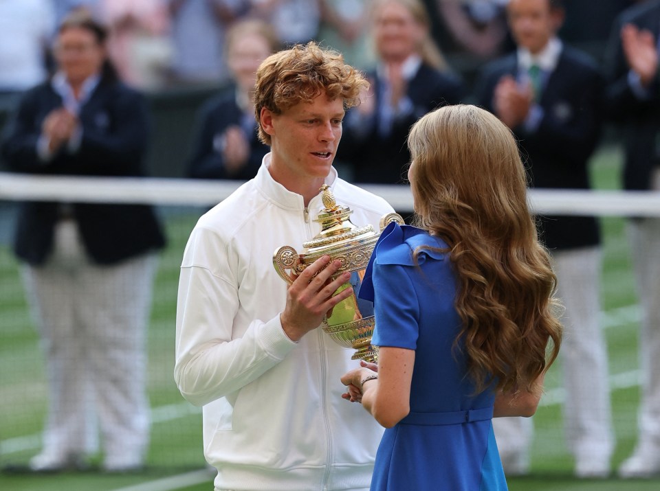 Catherine, Princess of Wales, presenting the Wimbledon men's singles trophy to Jannik Sinner.