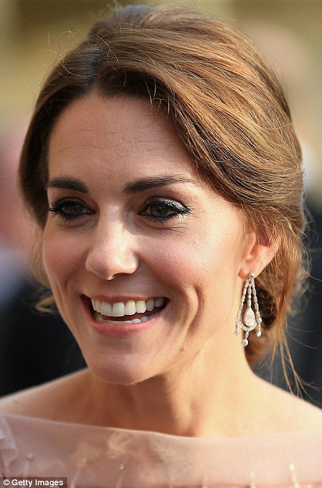 The royal showcased a subtle but glamorous beauty look with neutral tones and a slick of berry lipstick