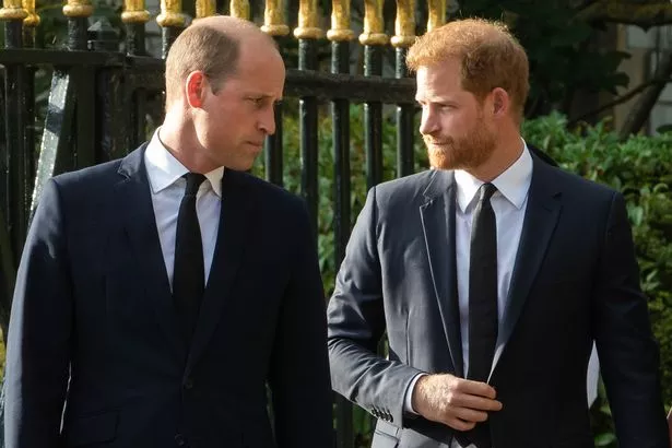 Prince William, the new Prince of Wales, and Prince Harry, the Duke of Sussex, arrive to view floral tributes to Queen Elizabeth II laid outside Cambridge Gate at Windsor Castle on 10th September 2022 in Windsor, United Kingdom