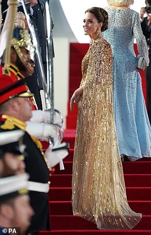 Looking effortlessly elegant, Kate's dress had a bespoke 1970s-style cape attached