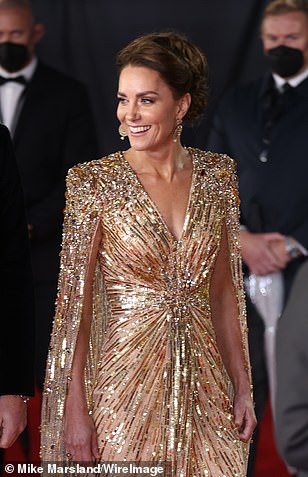 The royal beauty completed the look with gold earrings and shoes