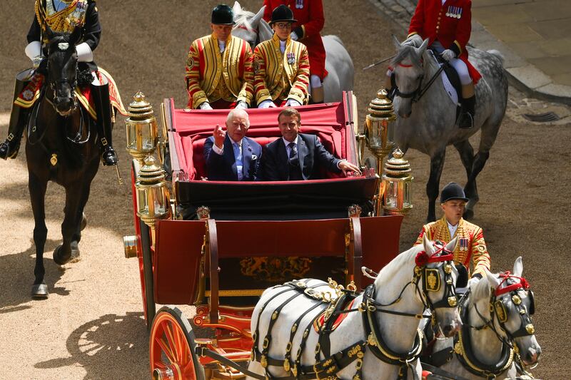 King Charles III and President of France, Emmanuel Macron arrive in a carriage at the Ceremonial Welcome for the state visit