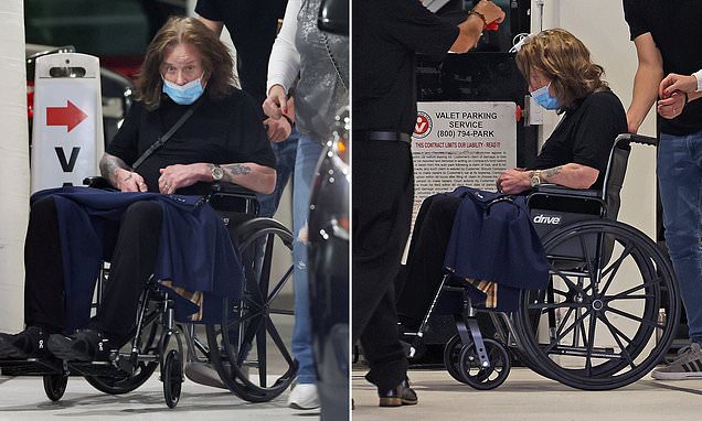 Ozzy Osbourne, 74, looks frail as he is pushed in a wheelchair after his son Jack revealed his daughter is 'terrified' of her own grandfather | Daily Mail Online