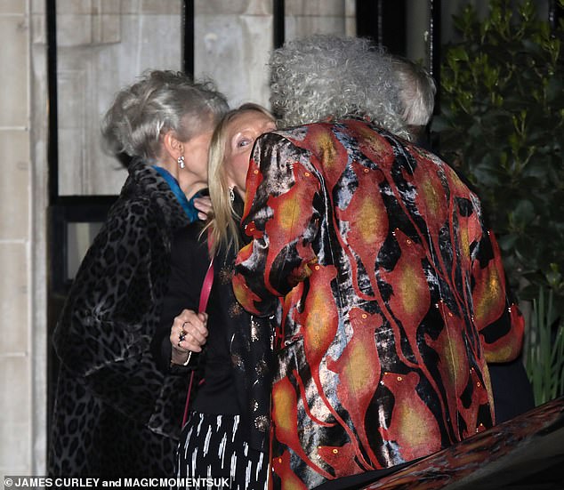 Brian kissed a guest on the cheek as they said their goodbyes