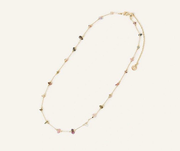 The dainty necklace features amethyst, rose quartz and onyx, which are said to have dealing properties