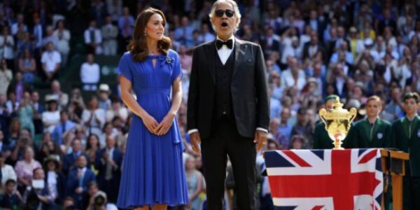 Wimbledon had never seen silence like this. No announcement. No spotlight. Just the Princess of Wales stepping onto Centre Court beside Andrea Bocelli, as 15,000 spectators fell still — breath held, hearts paused. And then, with no microphone, Catherine began to sing: “God Save the King.” Her voice — delicate yet steady — intertwined with Bocelli’s soaring tenor, lifting through the summer air like a prayer wrapped in tradition. It wasn’t just a performance. It was a moment. Some called it a symbol of unity. Others, a quiet message in uncertain times. But one thing is certain: Catherine’s voice didn’t just echo across Centre Court… it echoed across a nation. 👇👇 WATCH THE MOMENT THAT MADE HISTORY