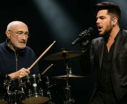 “He didn’t give me a song — he gave me a storm… and I had to survive it.” Last night, in a fog-drenched Royal Albert Hall, Adam Lambert and Phil Collins didn’t just perform “In The Air Tonight” — they summoned it from the depths. As the haunting heartbeat of the track pulsed through the darkness, Collins’ weathered voice tore into the stillness.