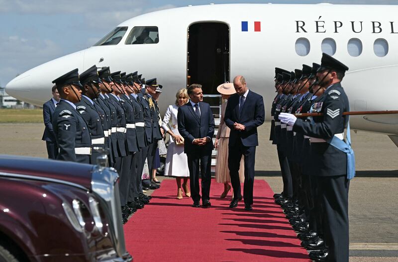 France's President Emmanuel Macron and his wife Brigitte Macron had an awkward encounter on arrival in the U.K.