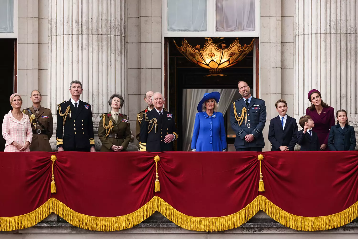 Britain's Sophie, Duchess of Edinburgh, Britain's Prince Edward, Duke of Edinburgh, Vice Admiral Timothy Laurence, Britain's Princess Anne, Princess Royal, Britain's Prince Edward, Duke of Kent, Britain's King Charles III, Britain's Queen Camilla, Britain's Prince William, Prince of Wales, Britain's Prince George of Wales, Britain's Prince Louis of Wales, Britain's Catherine, Princess of Wales and Britain's Princess Charlotte of Wales watch the Red Arrows flypast from Buckingham Palace balcony