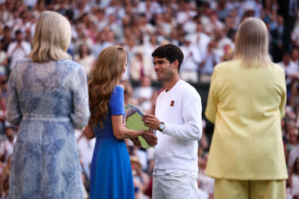 Catherine, Princess of Wales, presenting a runner-up trophy to Carlos Alcaraz at Wimbledon.
