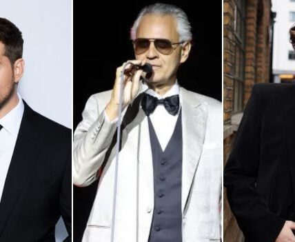 “Under Rome’s Starlit Sky, Michael Bublé, Adam Lambert & Andrea Bocelli Unite for la Notte Delle Voci — a Once-In-A-Lifetime Night Where Music Made Time Stand Still”  In the Heart of Rome, History Met Harmony as Michael Bublé, Adam Lambert, and Andrea Bocelli Shared the Stage for la Notte Delle Voci — an Unforgettable Fusion of Jazz, Pop, and Opera. Beneath Golden-Lit Ancient Arches, the Trio Delivered Spellbinding Performances of Nessun Dorma, Who Wants to Live Forever, and a Reinvention of Feeling Good That Left the Crowd Breathless.