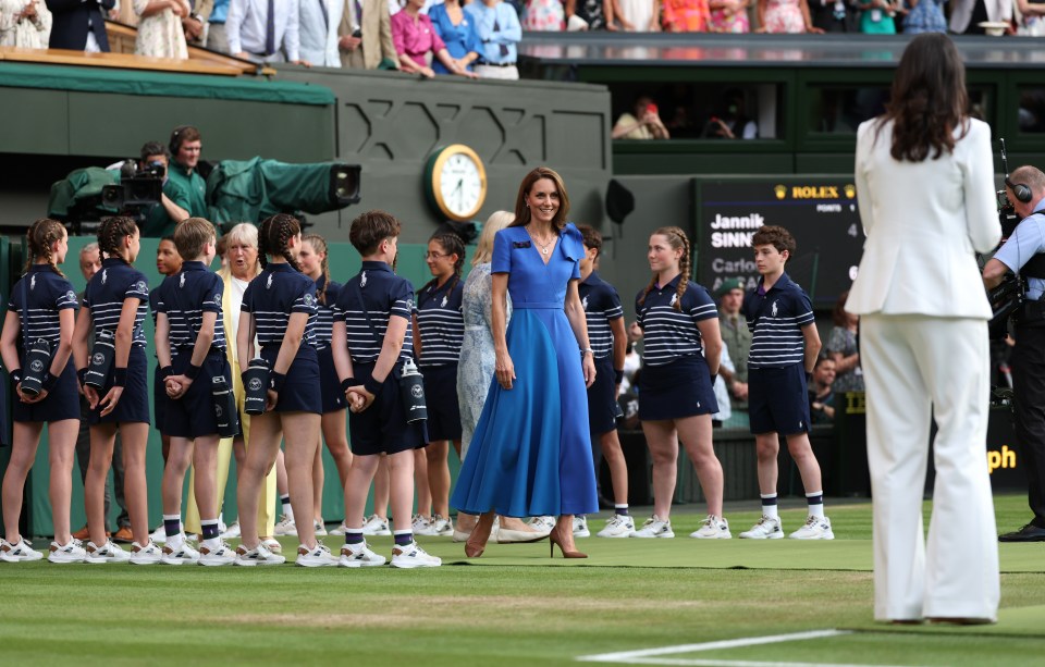 Catherine, Princess of Wales, presents the Gentlemen's Singles Trophy at Wimbledon.