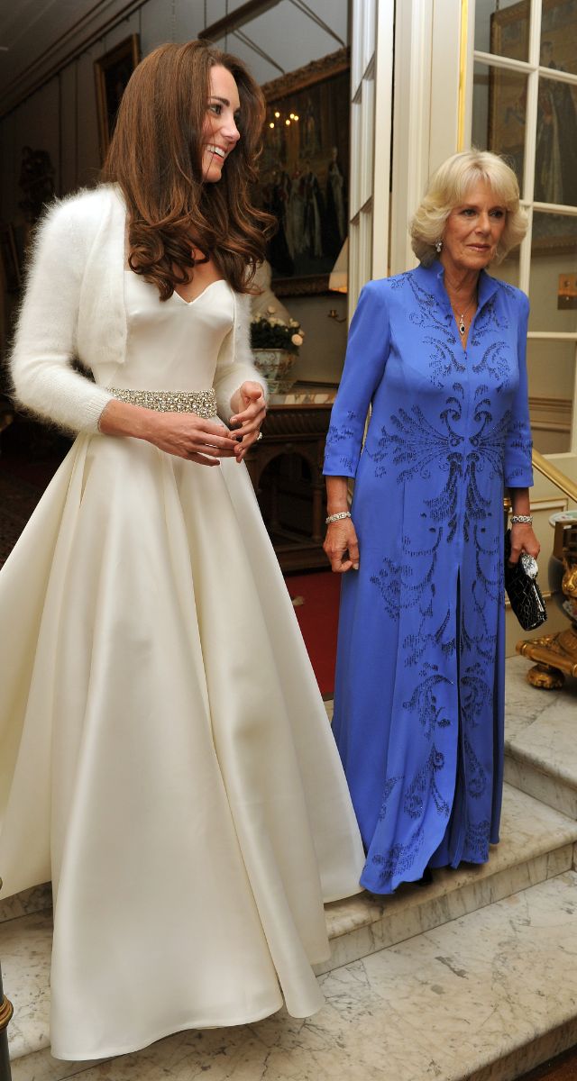 LONDON, UNITED KINGDOM - APRIL 29: Catherine, Duchess of Cambridge (L) and Camilla, Duchess of Cornwall leave Clarence House to travel to Buckingham Palace for the evening celebrations following her wedding to Prince William, Duke of Cambridge on April 29, 2011 in London, England. The marriage of the second in line to the British throne was led by the Archbishop of Canterbury and was attended by 1900 guests, including foreign Royal family members and heads of state. Thousands of well-wishers from around the world have also flocked to London to witness the spectacle and pageantry of the Royal Wedding.