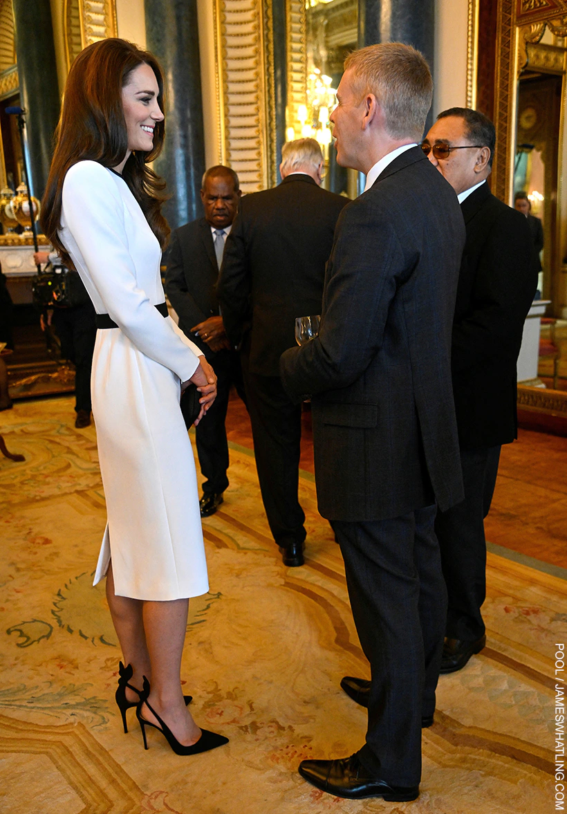 The Princess of Wales in a white and black dress at a lunch on the eve of the coronation