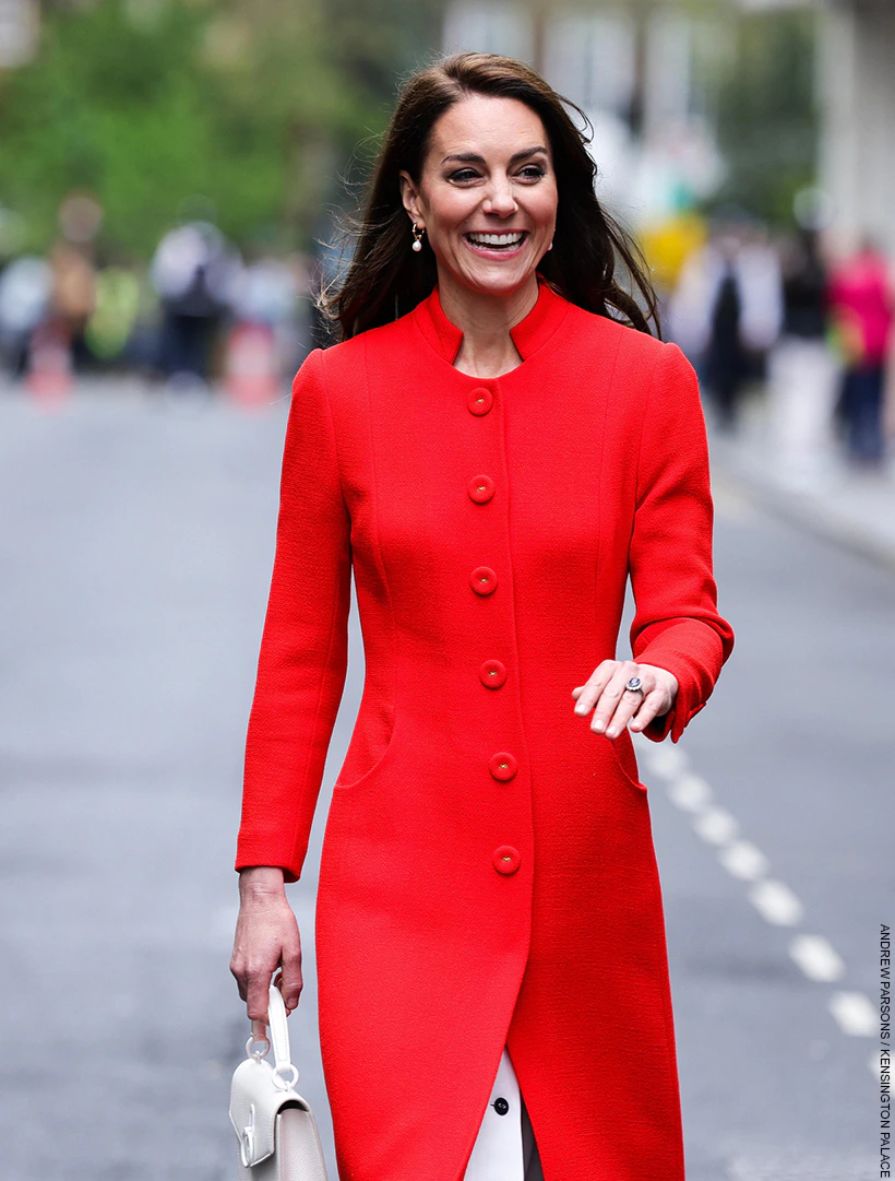 Kate Middleton looking glamorous in her red coat in Soho