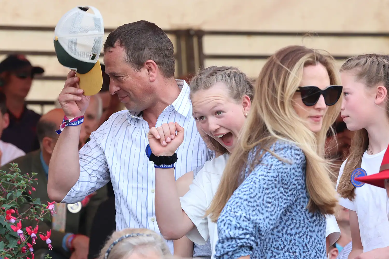 Peter Phillips and his daughter Savannah Phillips along with Peter's new girlfriend, Nurse Harriet Sperling (blue dress) attend the final day of the Badminton Horse Trials 2024 at Badminton House
