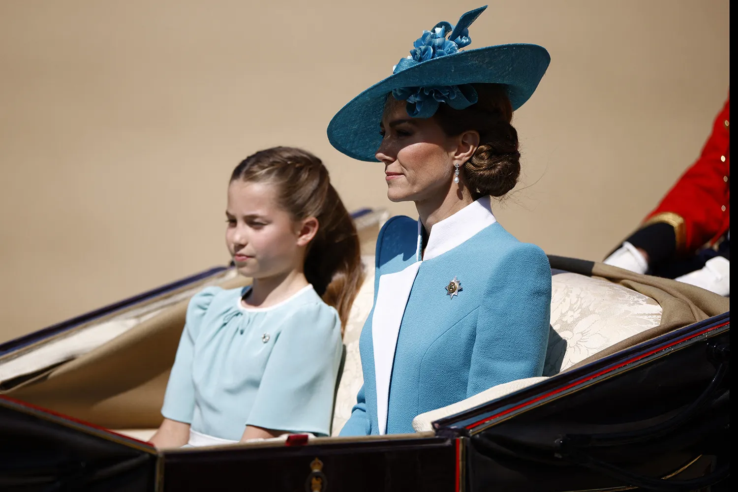 Britain's Catherine, Princess of Wales, (R) and Britain's Princess Charlotte of Wales arrive to Horse Guards Parade for the King's Birthday Parade, "Trooping the Colour", in London