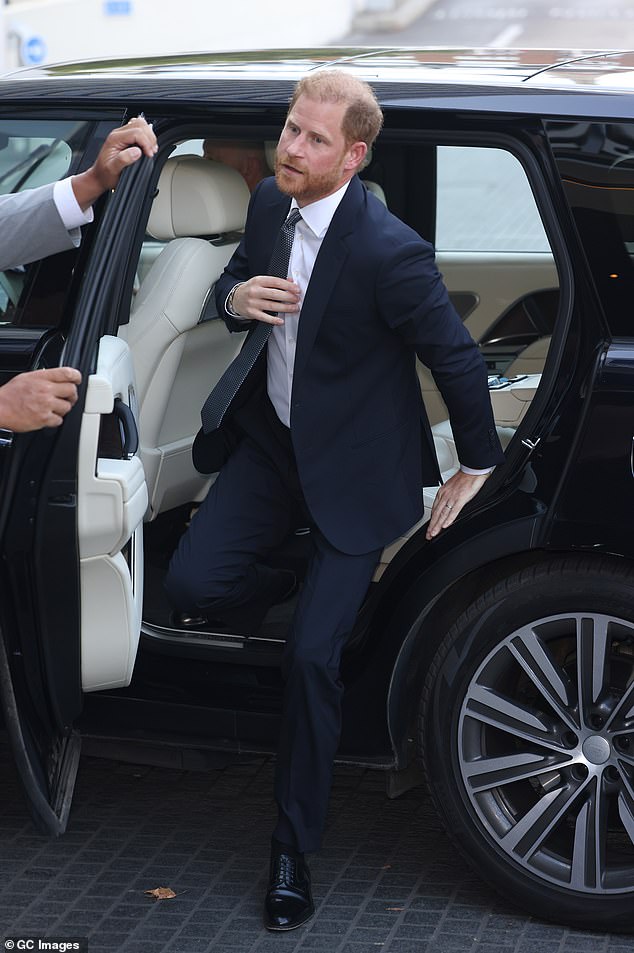 Prince Harry steps out of a car after being escorted to the Royal Lancaster hotel for the WellChild Awards today