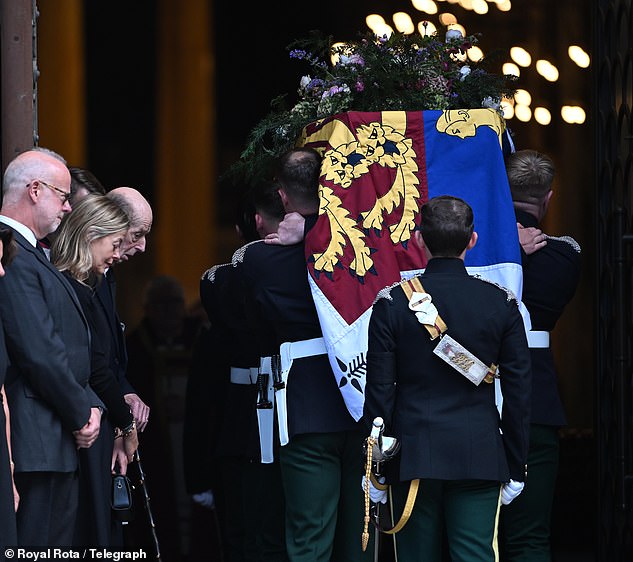 The Duke of Kent bows his head as the coffin enters Westminster Cathedral yesterday